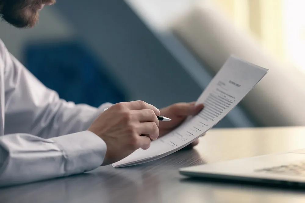 Documents & Forms- Businessman Reading Documents